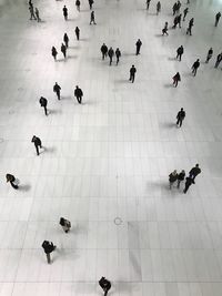 High angle view of people on tiled floor