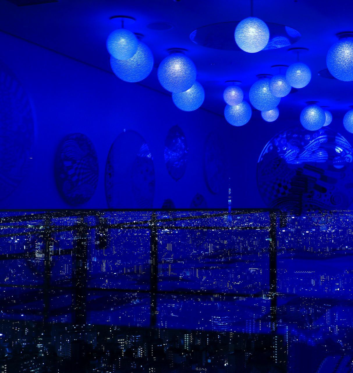 CLOSE-UP OF ILLUMINATED BLUE LIGHTS AT AQUARIUM