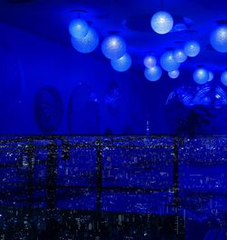 Close-up of illuminated blue water in aquarium