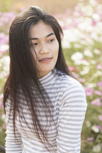 Close-up of young woman at park