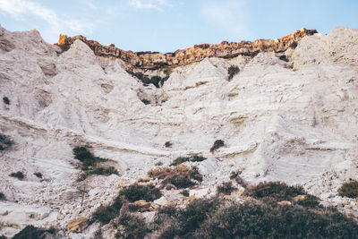 Rock formations on mountain against sky