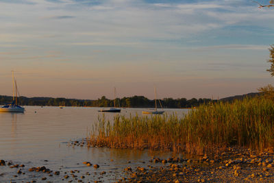 Scenic view of lake against sky during sunset