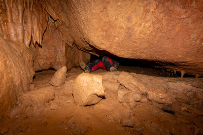 Rear view of man standing on rock