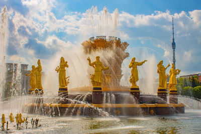 Statue of fountain against cloudy sky