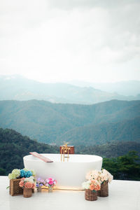 Scenic view of sea and mountains against sky