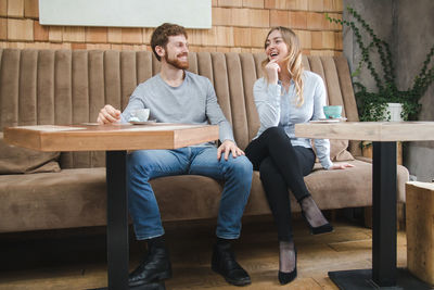 Laughing couple in cafeteria