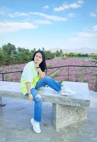 Girl sitting posing with nature view