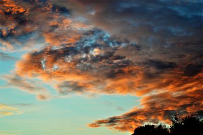 Low angle view of dramatic sky during sunset