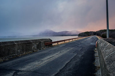 Empty road against sky