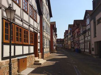 Street amidst buildings against sky