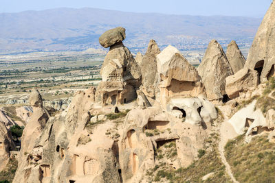 Panoramic view of statues on rock formation