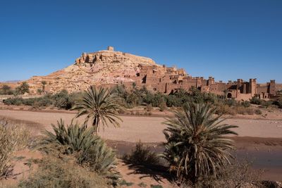 Built structure on landscape against clear sky