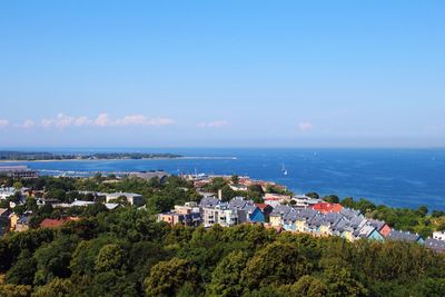 High angle view of houses by sea