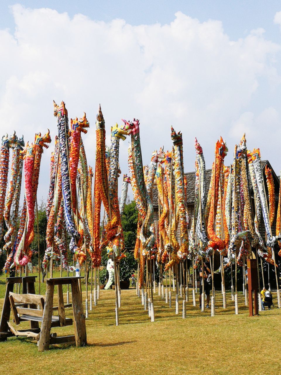 LOW ANGLE VIEW OF UMBRELLAS HANGING AGAINST SKY