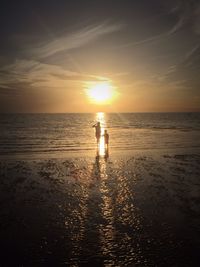 Scenic view of sea at sunset