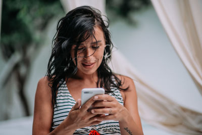 Young woman using mobile phone