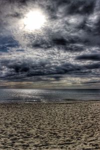 Scenic view of sea against cloudy sky
