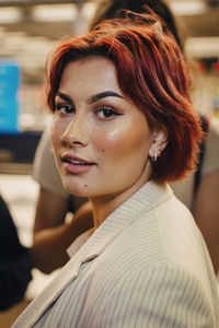 Portrait of redhead female student at subway station