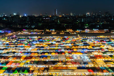 High angle view of illuminated market in city at night
