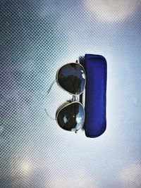 Close-up of sunglasses on mirror