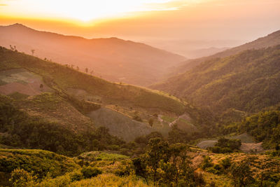 Scenic view of mountains against sky during sunset