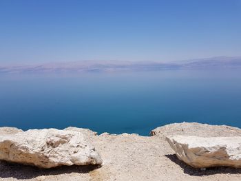 Scenic view of sea against clear blue sky