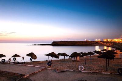 Scenic view of sea against clear sky at sunset