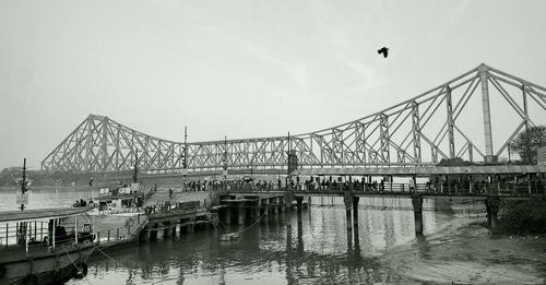 Street journals- howrah bridge over river against sky