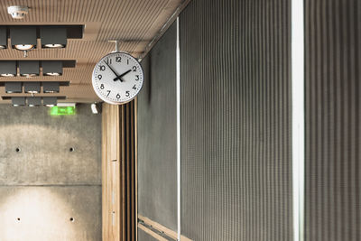 Close-up of clock on wall