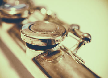 High angle view of old metal on table against wall