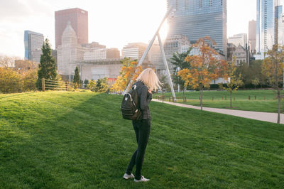 Full length of woman standing in park