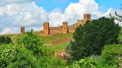 Panoramic view of historic building against cloudy sky