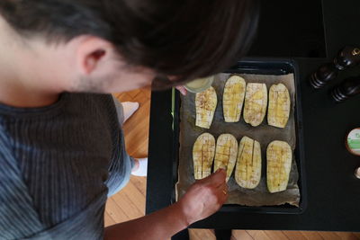 High angle view of man preparing food