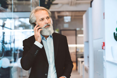 Portrait of young man using mobile phone