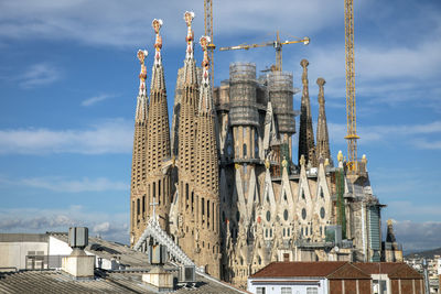 Low angle view of buildings in city against sky