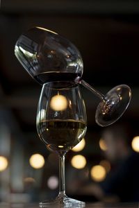 Close-up of wine glasses on table