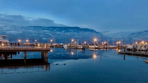 Scenic view of lake against sky at night