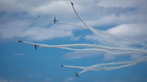 Low angle view of airplane flying in sky