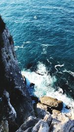 High angle view of rock formation in sea