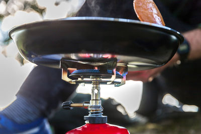 Close-up of hand holding bicycle