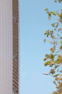 Low angle view of buildings against clear blue sky