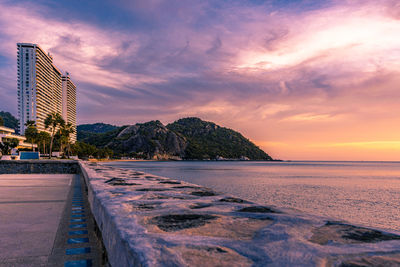 Scenic view of beach against sky during sunset