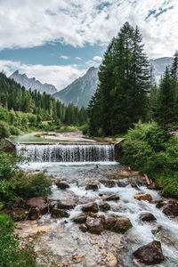 Water cascade in the mountains. view of the dolomites