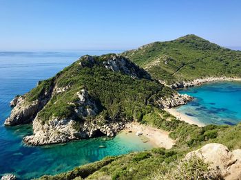 Scenic view of sea against clear blue sky