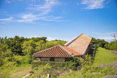 Gazebo on field against sky