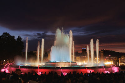 Colors of magic fountain of montjuic in barcelona's placa d'espanya, - spain.