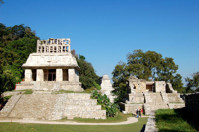 Low angle view of building against clear blue sky