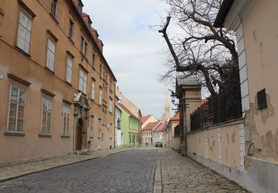 Houses in city against sky