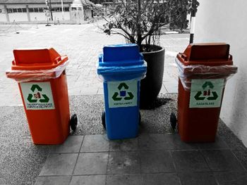 Garbage bin by trees