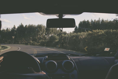 Cropped image of car on road